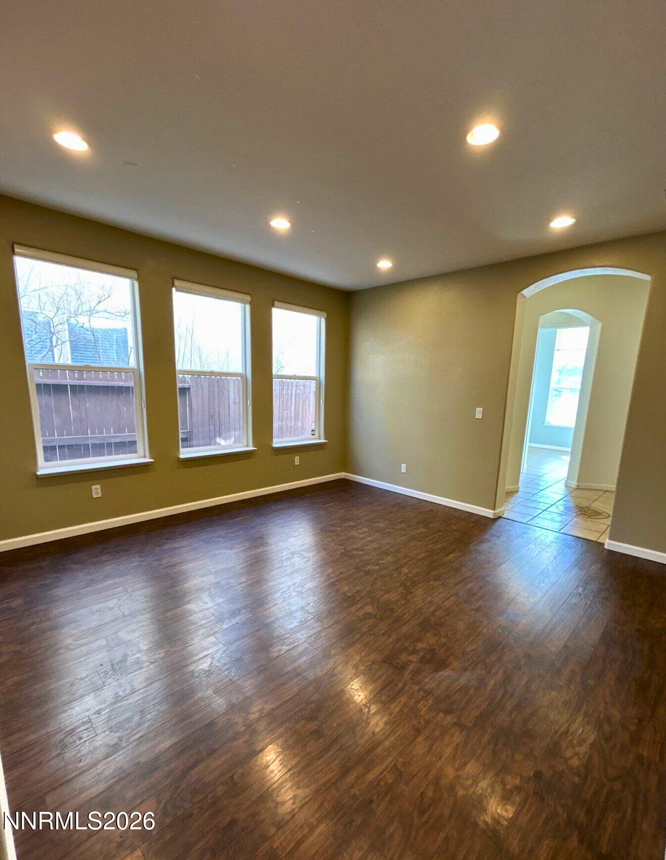 1783 Back Country Road Reno, NV 89521 - Photo 7 of 28 an empty room with wooden floor and windows