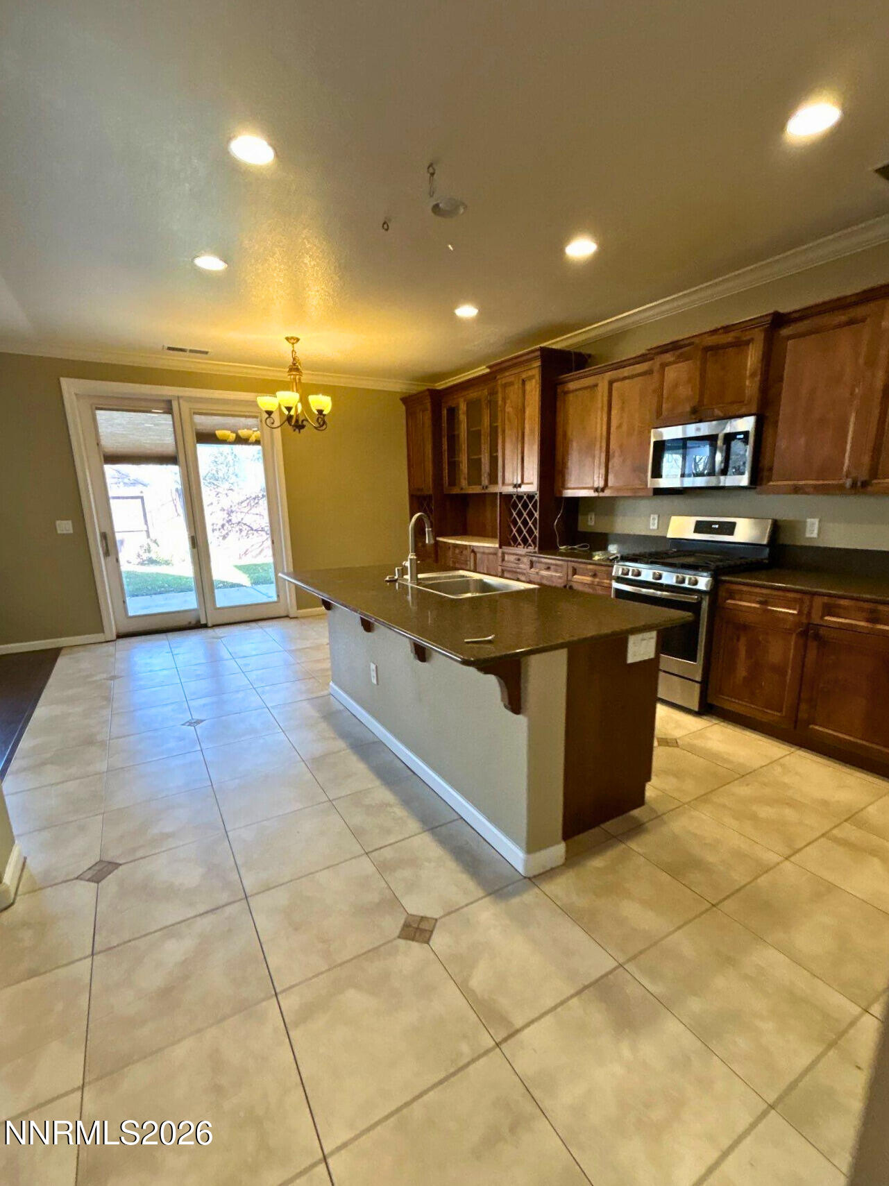 1783 Back Country Road Reno, NV 89521 - Photo 8 of 28 a large kitchen with stainless steel appliances granite countertop a stove and cabinets