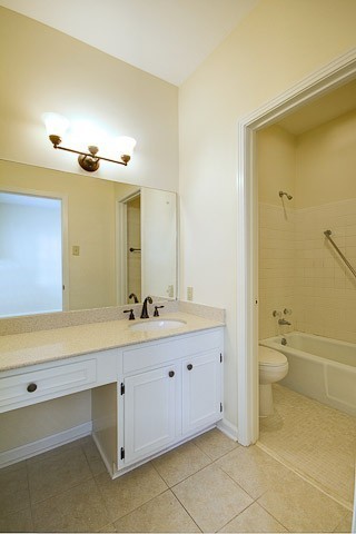 4505 Harding Pike, Unit 106 Nashville, TN 37205 - Photo 17 of 22 a bathroom with a double vanity sink toilet and a tub