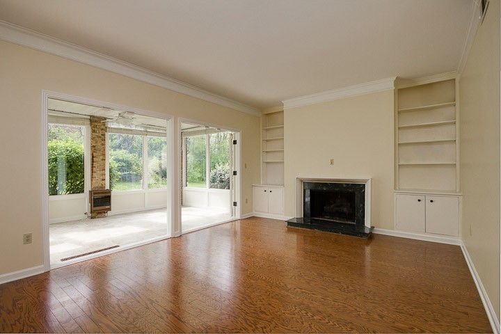 4505 Harding Pike, Unit 106 Nashville, TN 37205 - Photo 2 of 22 a view of an empty room with a fireplace and a window