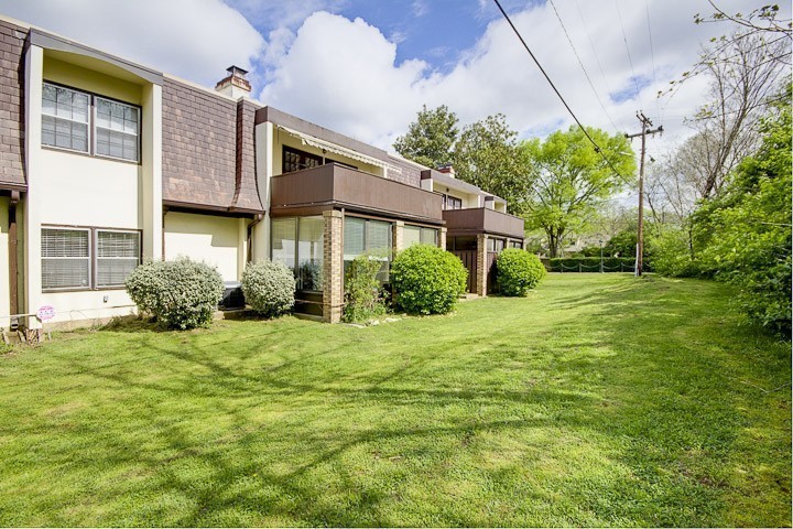 4505 Harding Pike, Unit 106 Nashville, TN 37205 - Photo 21 of 22 a front view of a house with garden