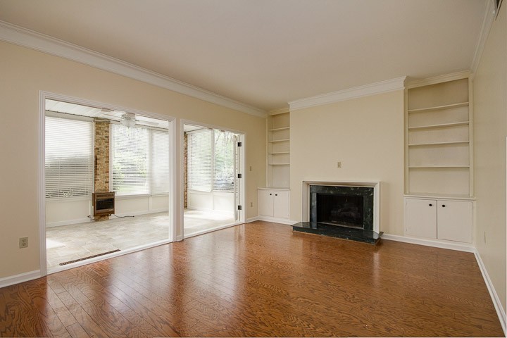 4505 Harding Pike, Unit 106 Nashville, TN 37205 - Photo 3 of 22 a view of an empty room with a fireplace and a window