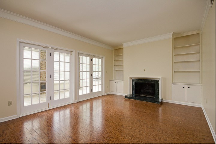 4505 Harding Pike, Unit 106 Nashville, TN 37205 - Photo 4 of 22 wooden floor fireplace and windows in an empty room
