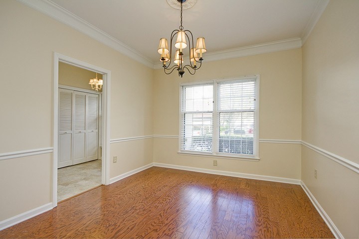 4505 Harding Pike, Unit 106 Nashville, TN 37205 - Photo 9 of 22 an empty room with wooden floor and windows
