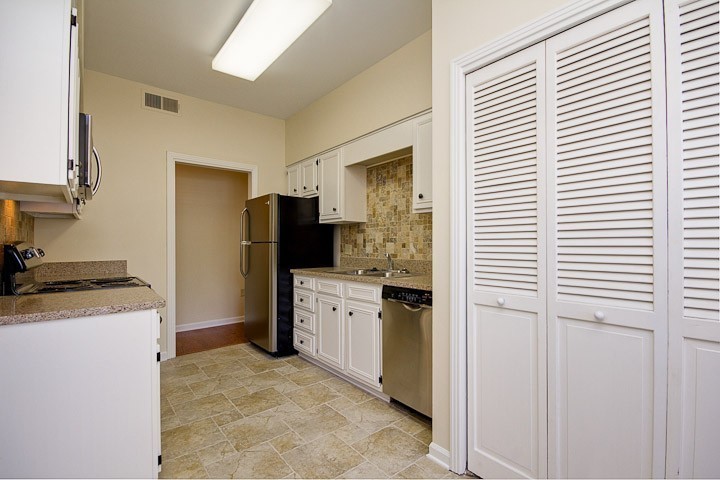 4505 Harding Pike, Unit 106 Nashville, TN 37205 - Photo 10 of 22 a kitchen with a refrigerator stove and sink