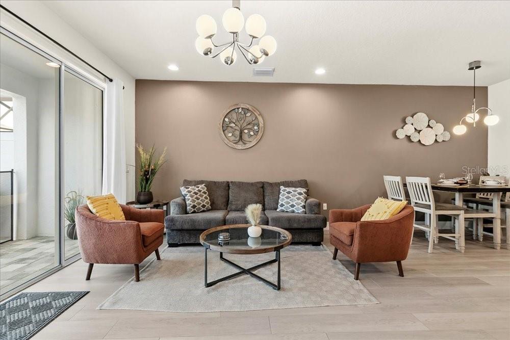 1385 Peaceful Way Clermont, FL 34714 - Photo 11 of 28 a living room with furniture and a table