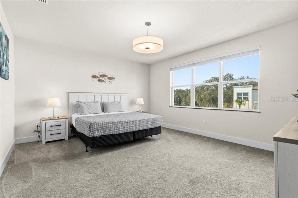 1385 Peaceful Way Clermont, FL 34714 - Photo 13 of 28 a bedroom with a bed and a window