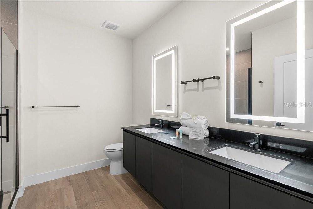 1385 Peaceful Way Clermont, FL 34714 - Photo 16 of 28 a bathroom with a sink and a mirror