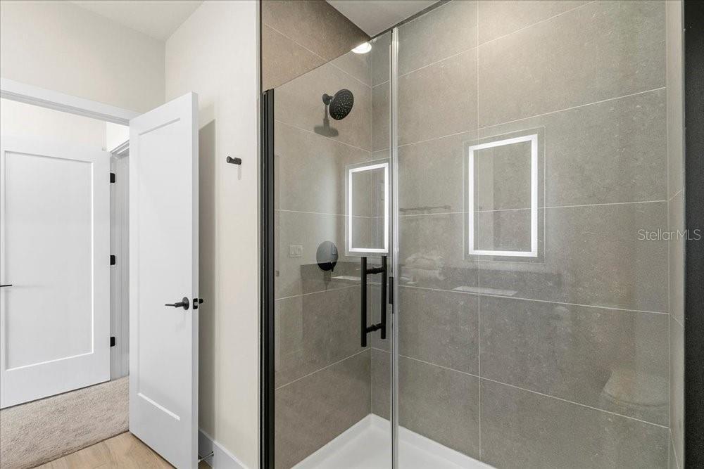 1385 Peaceful Way Clermont, FL 34714 - Photo 17 of 28 a bathroom with a shower and a sink