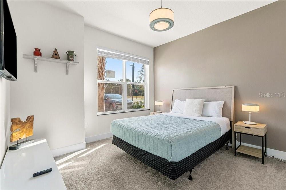 1385 Peaceful Way Clermont, FL 34714 - Photo 18 of 28 a bedroom with a bed and a window