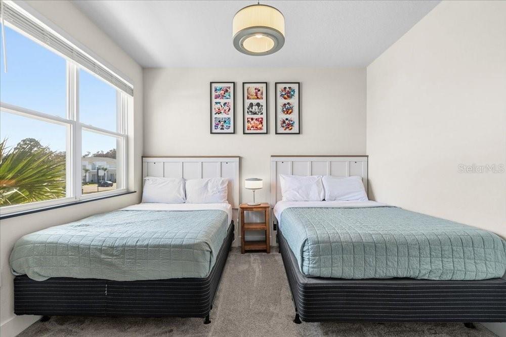 1385 Peaceful Way Clermont, FL 34714 - Photo 20 of 28 a bedroom with a bed and a window