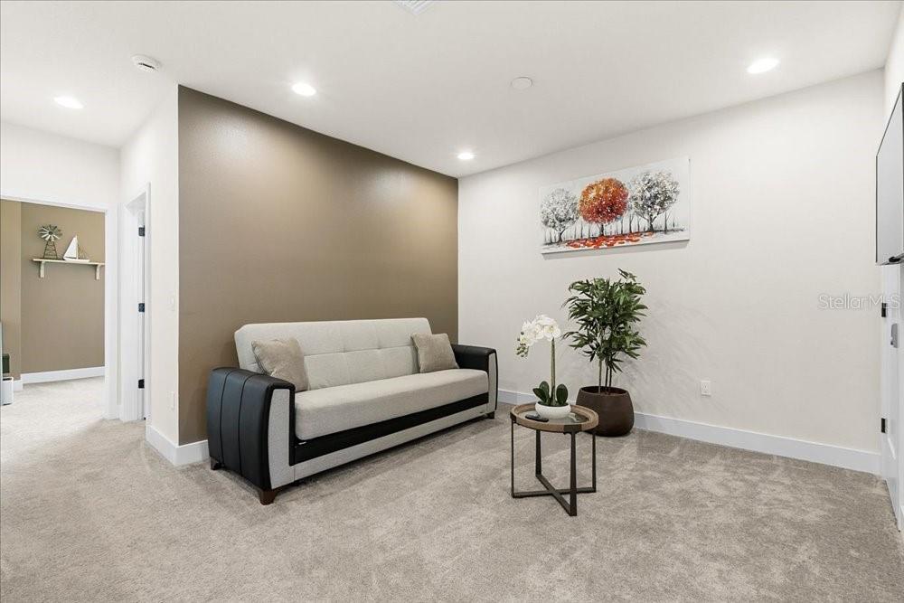 1385 Peaceful Way Clermont, FL 34714 - Photo 21 of 28 a living room with furniture and a potted plant