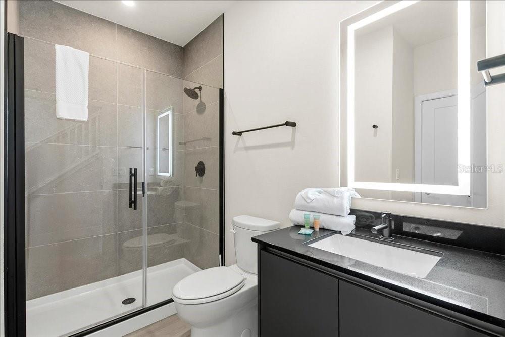 1385 Peaceful Way Clermont, FL 34714 - Photo 22 of 28 a bathroom with a sink and a mirror