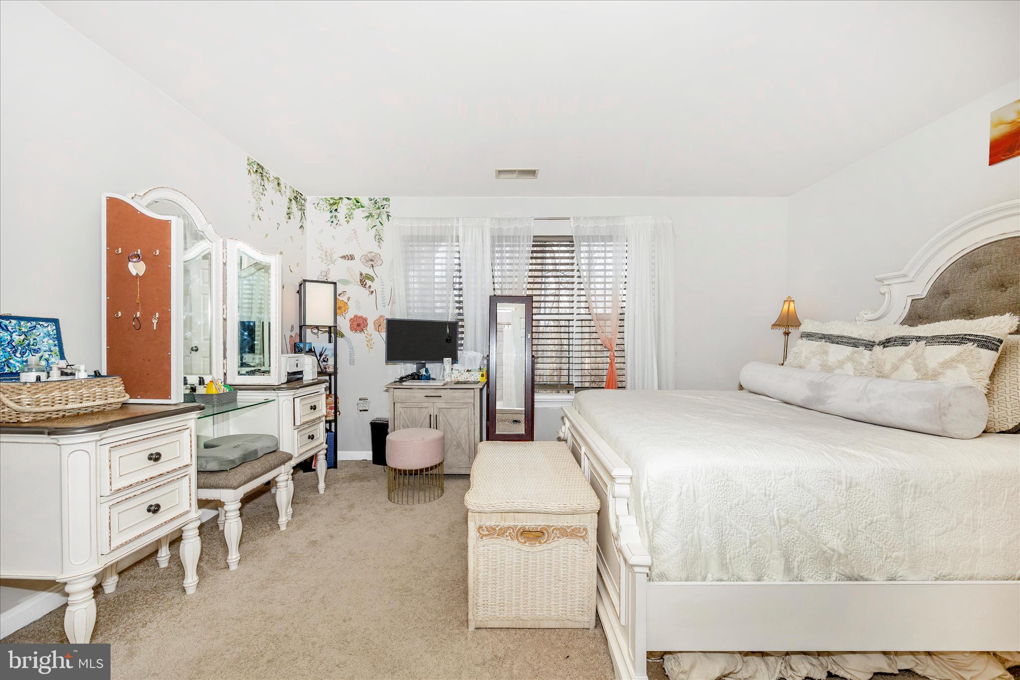 125 Timberbrook Lane, Unit 102 Gaithersburg, MD 20878 - Photo 17 of 38 a bed room with furniture and large window