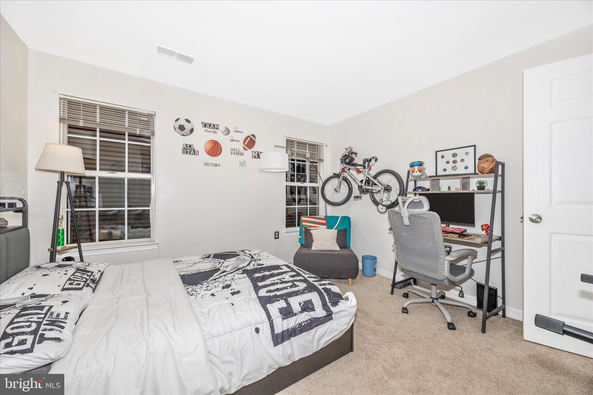125 Timberbrook Lane, Unit 102 Gaithersburg, MD 20878 - Photo 22 of 38 a bedroom with a bed and wooden floor