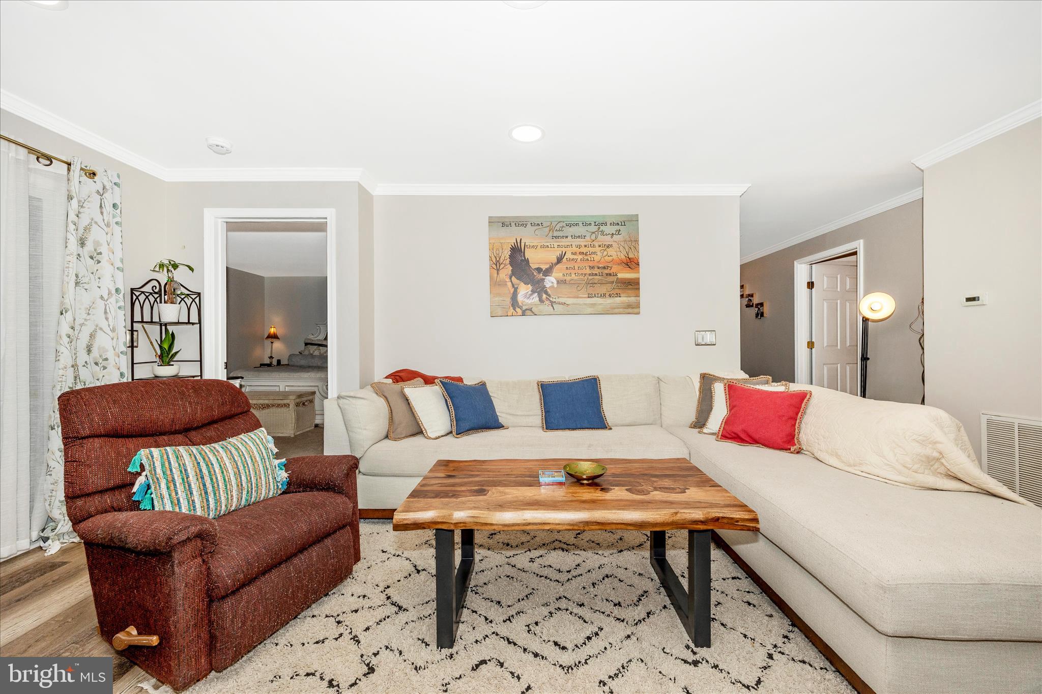 125 Timberbrook Lane, Unit 102 Gaithersburg, MD 20878 - Photo 7 of 38 a living room with furniture and a rug