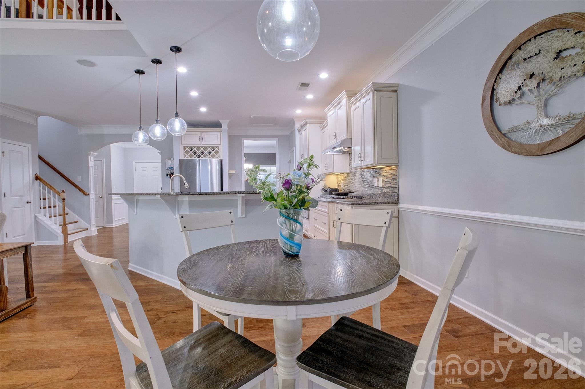 3078 Rhododendron Place Lake Wylie, SC 29710 - Photo 12 of 43 a dining room with furniture and a chandelier