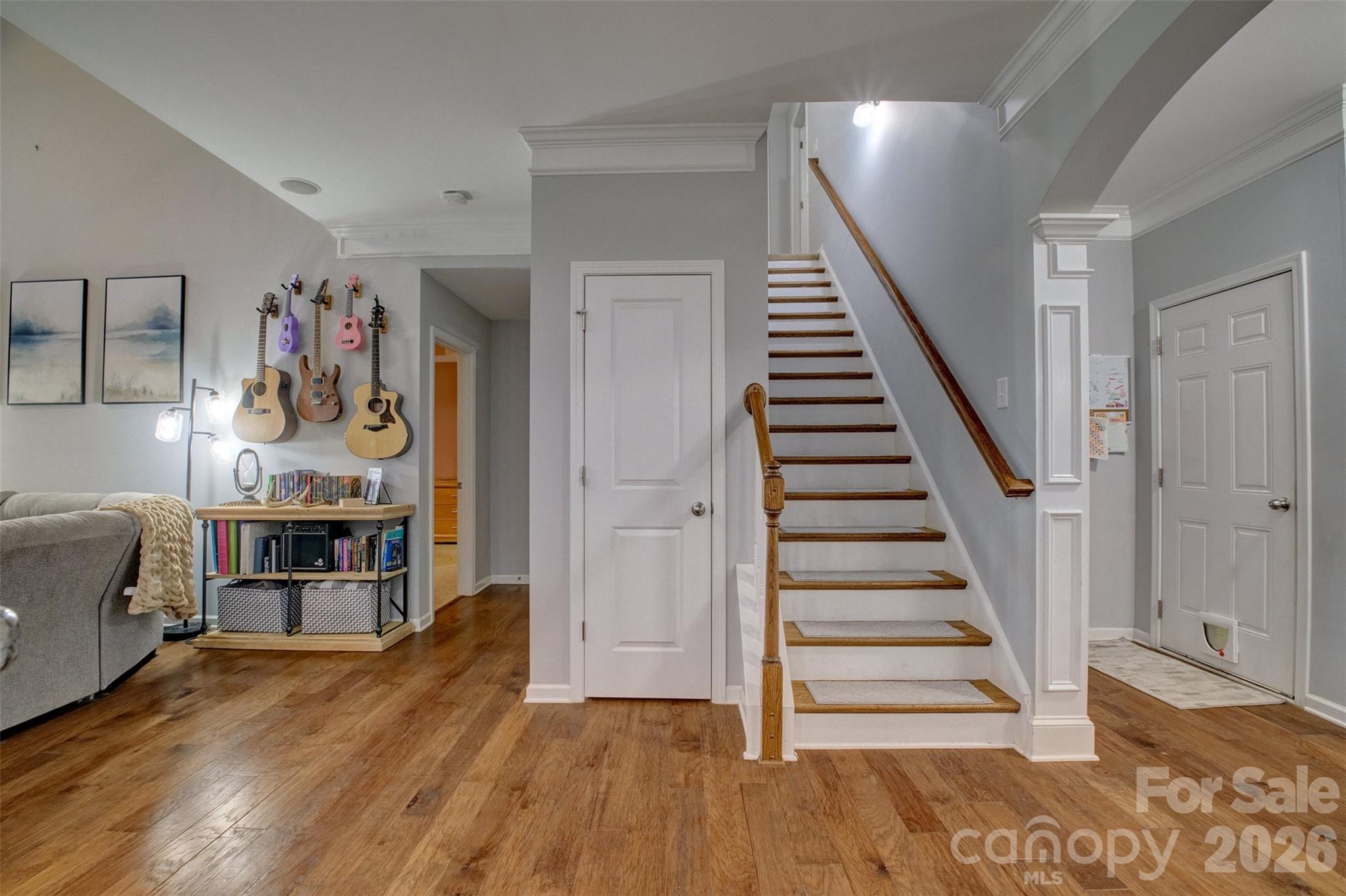 3078 Rhododendron Place Lake Wylie, SC 29710 - Photo 20 of 43 a view of a livingroom with wooden floor and stairs