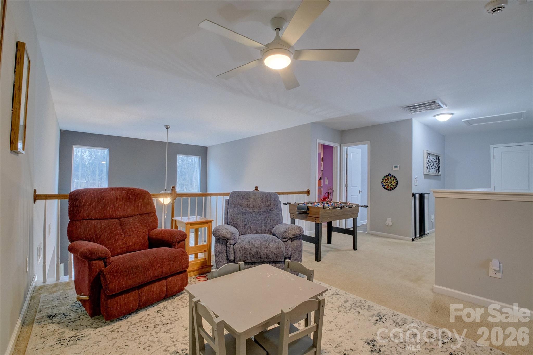 3078 Rhododendron Place Lake Wylie, SC 29710 - Photo 25 of 43 a living room with furniture a ceiling fan and a window