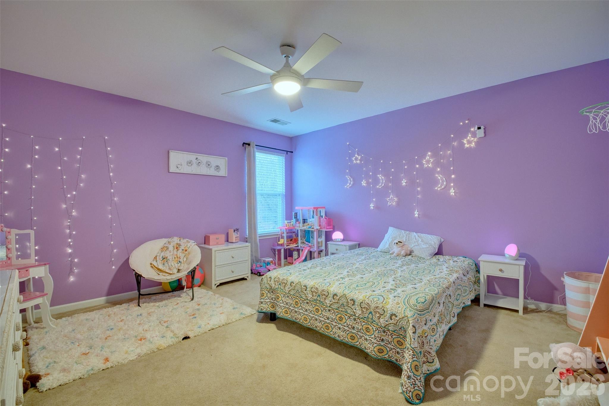3078 Rhododendron Place Lake Wylie, SC 29710 - Photo 28 of 43 a bedroom with a bed and a chandelier