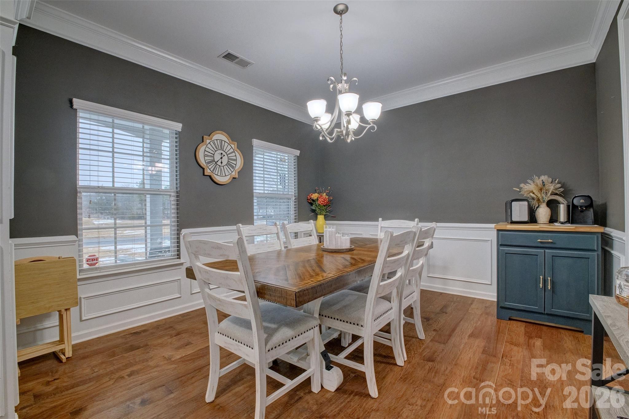 3078 Rhododendron Place Lake Wylie, SC 29710 - Photo 4 of 43 a view of a dining room with furniture a chandelier and wooden floor