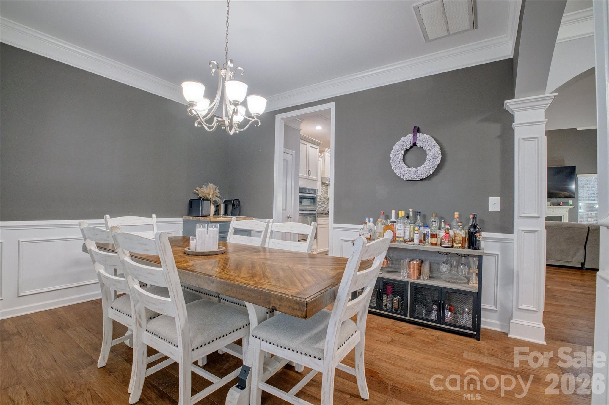 3078 Rhododendron Place Lake Wylie, SC 29710 - Photo 5 of 43 a view of a dining room and a table and chairs