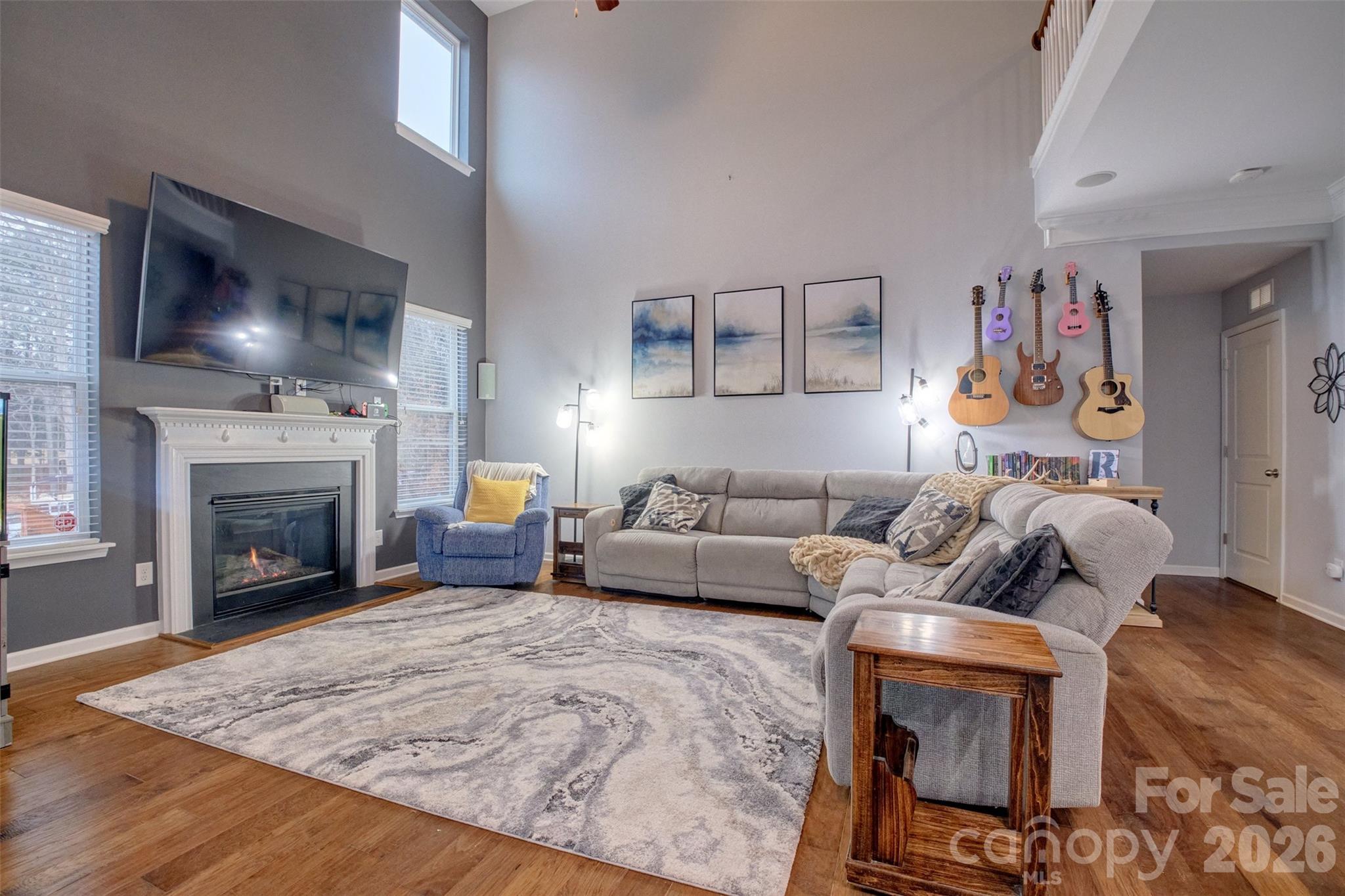 3078 Rhododendron Place Lake Wylie, SC 29710 - Photo 6 of 43 a living room with furniture and a fireplace
