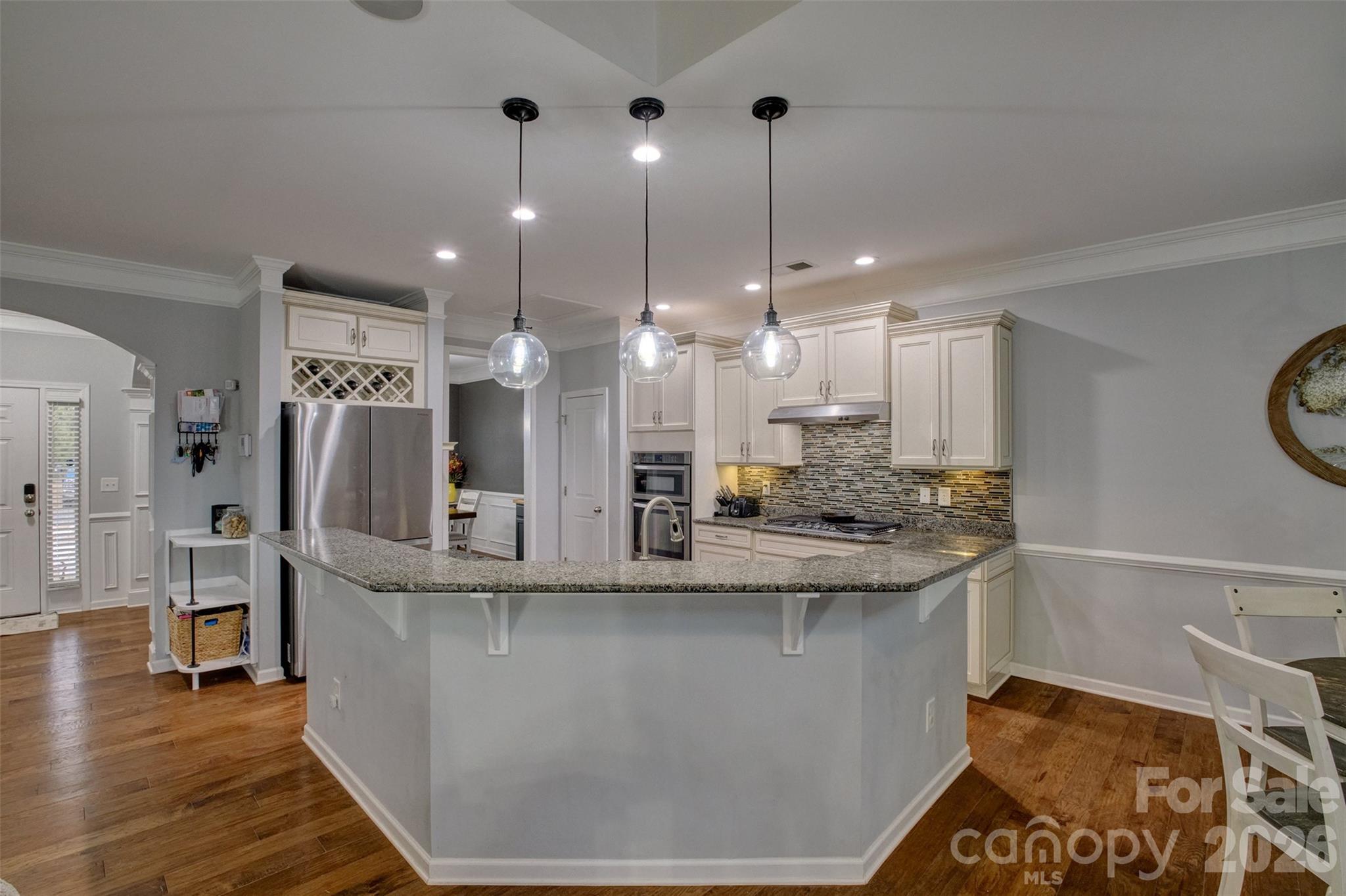 3078 Rhododendron Place Lake Wylie, SC 29710 - Photo 9 of 43 a kitchen with kitchen island a counter top space a sink stainless steel appliances and cabinets