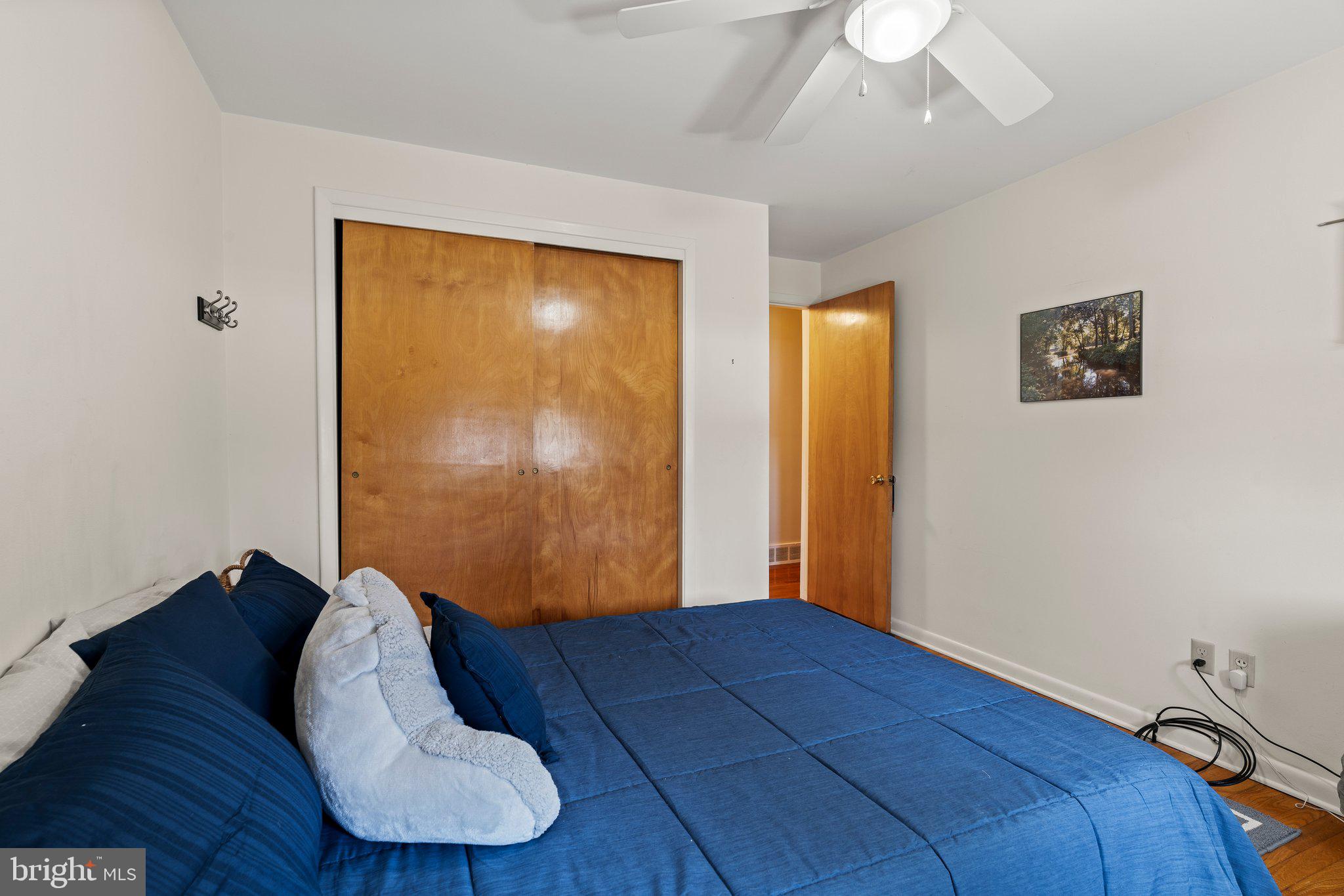694 Egypt Road Phoenixville, PA 19460 - Photo 19 of 38 a view of a livingroom with wooden floor and bedroom