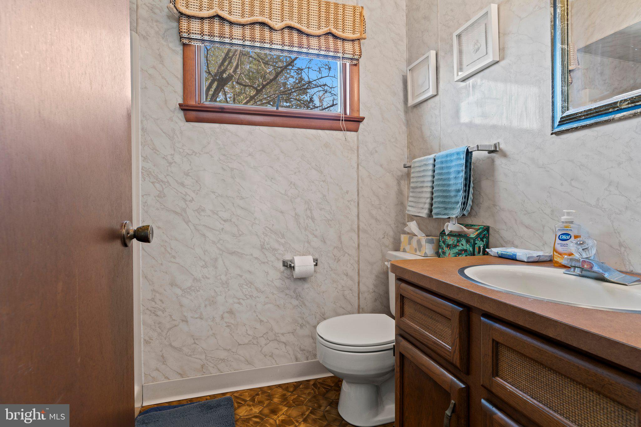 694 Egypt Road Phoenixville, PA 19460 - Photo 30 of 38 a bathroom with a granite countertop toilet sink and mirror