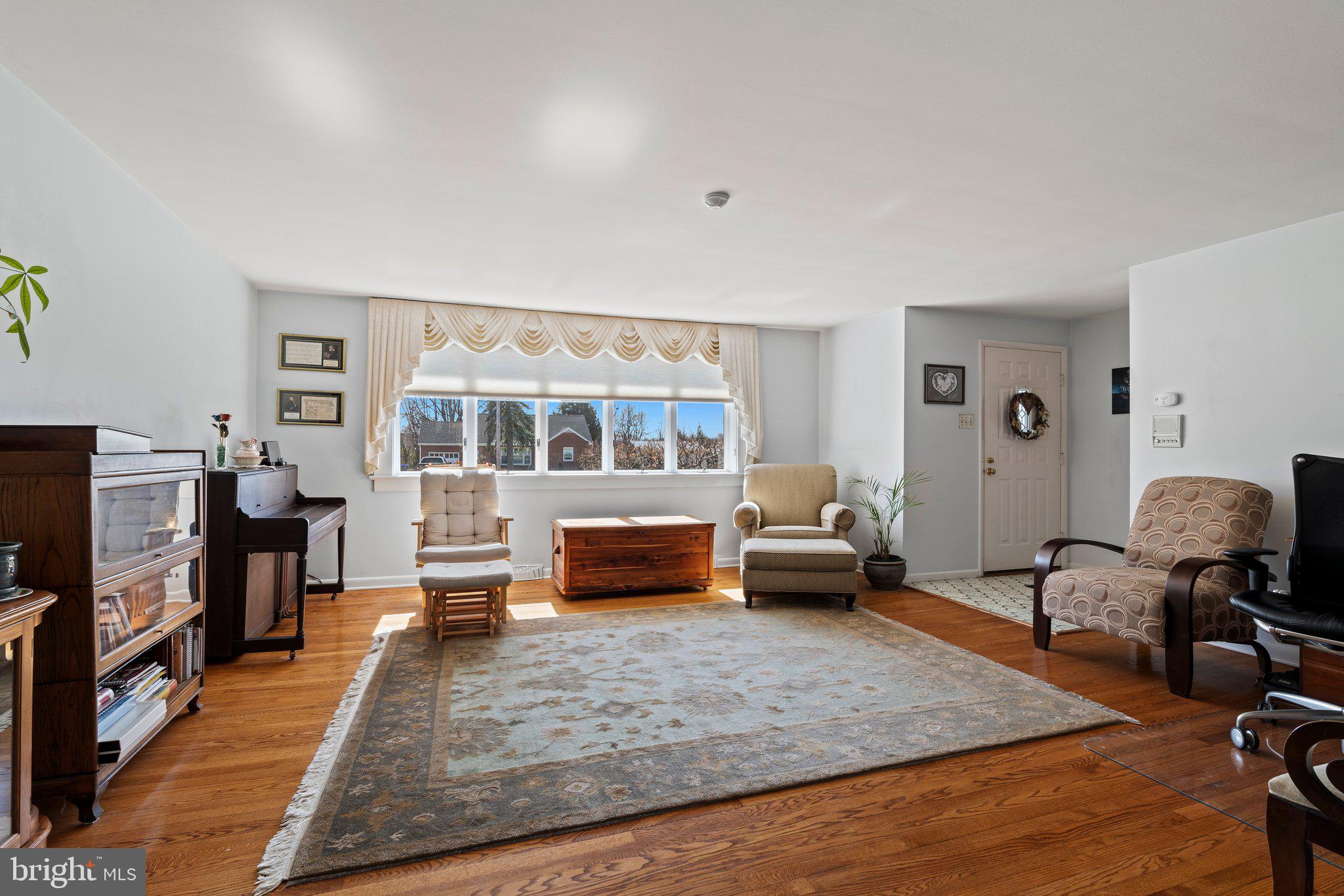 694 Egypt Road Phoenixville, PA 19460 - Photo 3 of 38 a living room with furniture and a flat screen tv