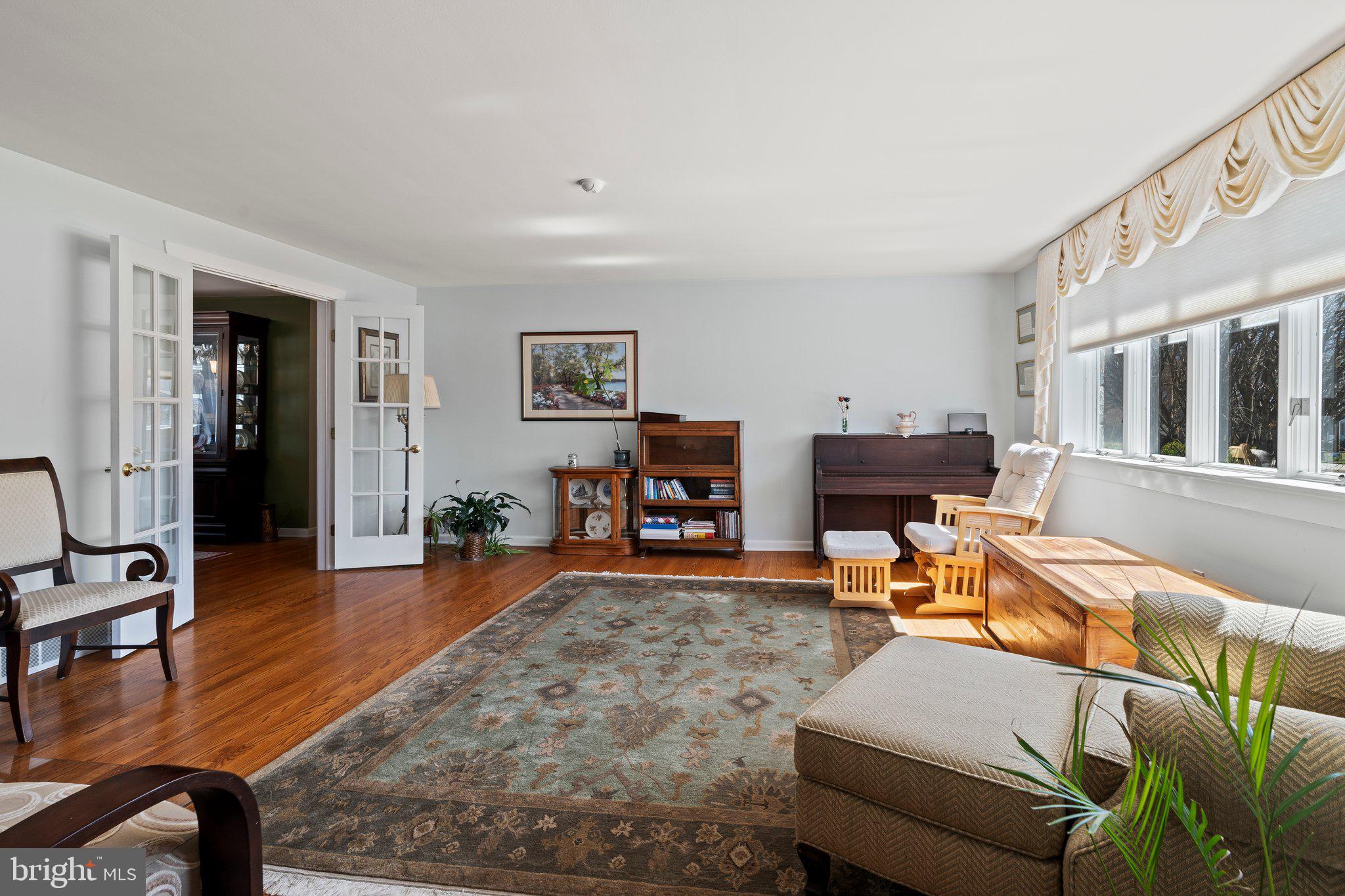 694 Egypt Road Phoenixville, PA 19460 - Photo 4 of 38 a living room with furniture and a wooden floor