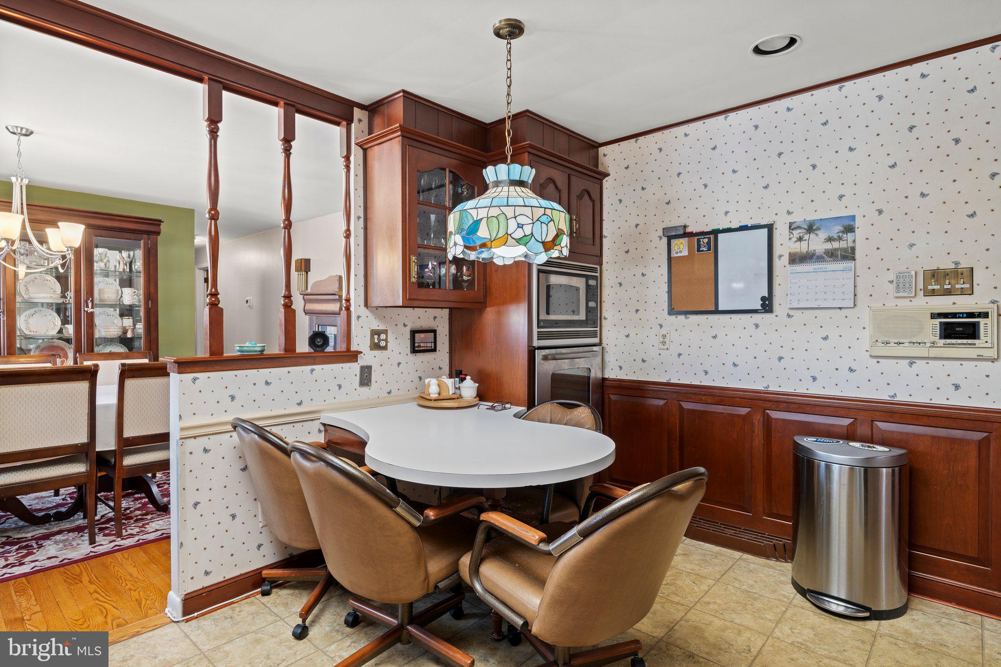 694 Egypt Road Phoenixville, PA 19460 - Photo 10 of 38 a dining room with stainless steel appliances granite countertop a dining table chairs and chandelier