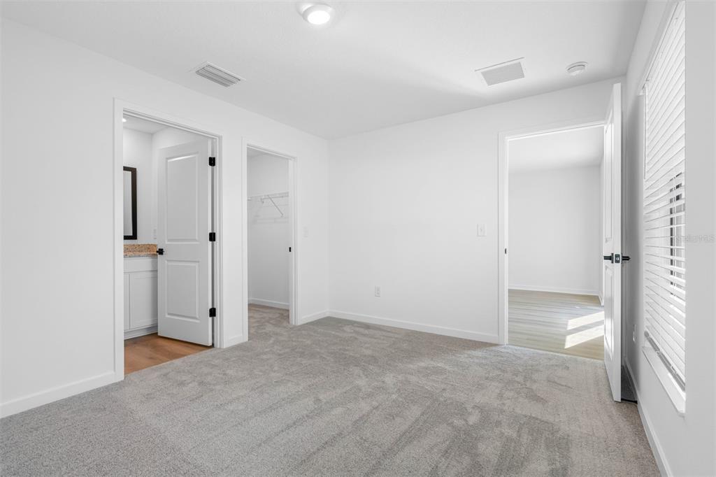 13053 Trapper John Road Weeki Wachee, FL 34614 - Photo 6 of 7 wooden floor and closet in a room