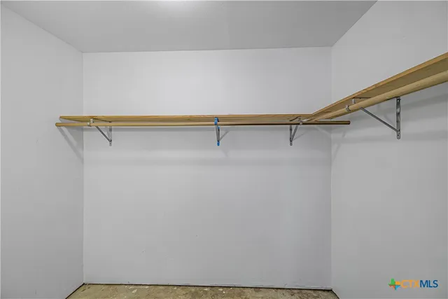 a view of a room with racks on the wall