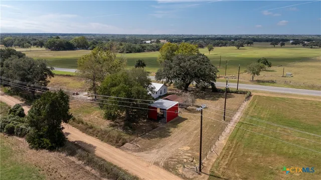 a view of a lake with a yard
