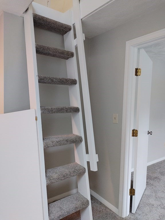 116 Russet Lane, Unit 116 Boxborough, MA 01719 - Photo 15 of 22 a view of staircase with white walls