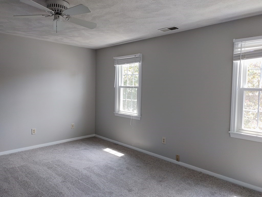 116 Russet Lane, Unit 116 Boxborough, MA 01719 - Photo 16 of 22 an empty room with a window