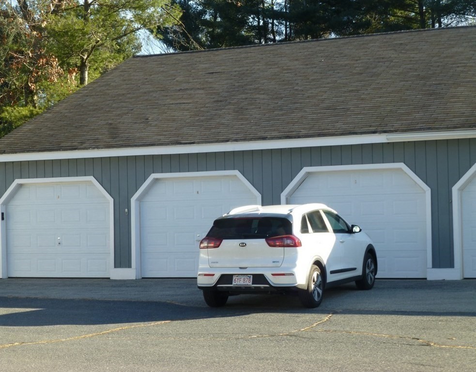 116 Russet Lane, Unit 116 Boxborough, MA 01719 - Photo 21 of 22 a car parked in front of a building