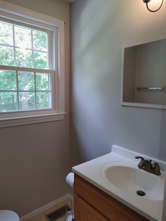 116 Russet Lane, Unit 116 Boxborough, MA 01719 - Photo 10 of 22 a bathroom with a sink and a window