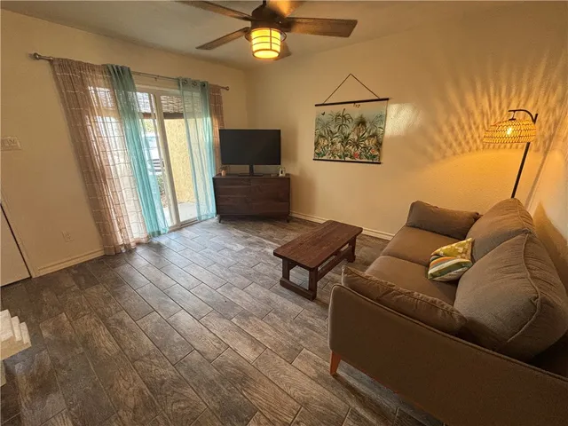 a living room with furniture and a window