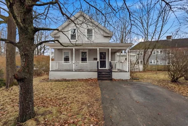a front view of a house with parking