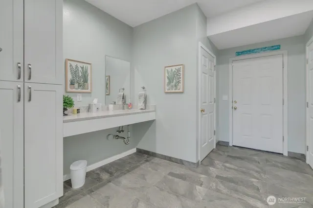 a bathroom with a sink and a mirror