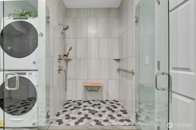 a bathroom with a sink a toilet and a shower