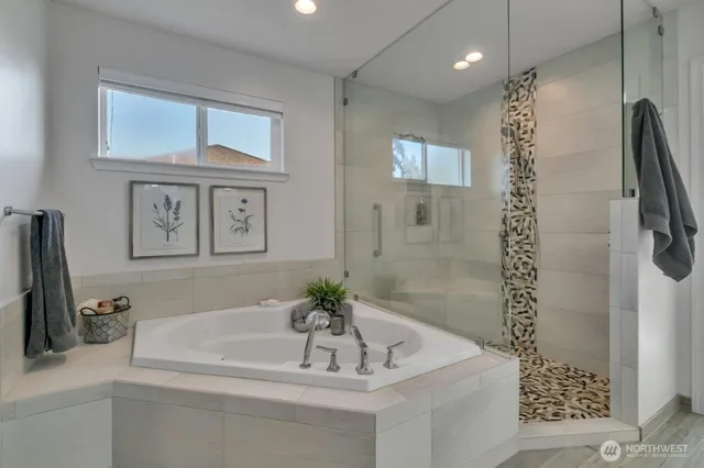 a bathroom with a bathtub and a sink