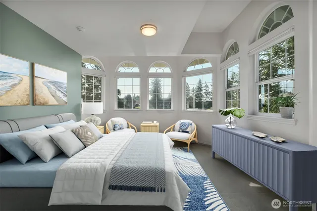 a spacious bedroom with bed and a large window