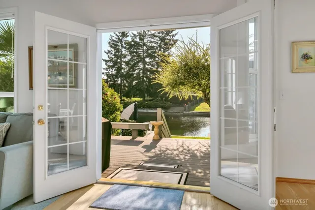 a view of a room with wooden floor and windows