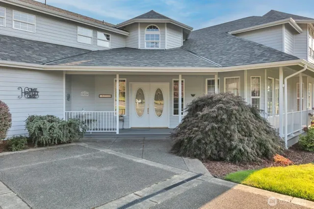 a front view of a house with garden