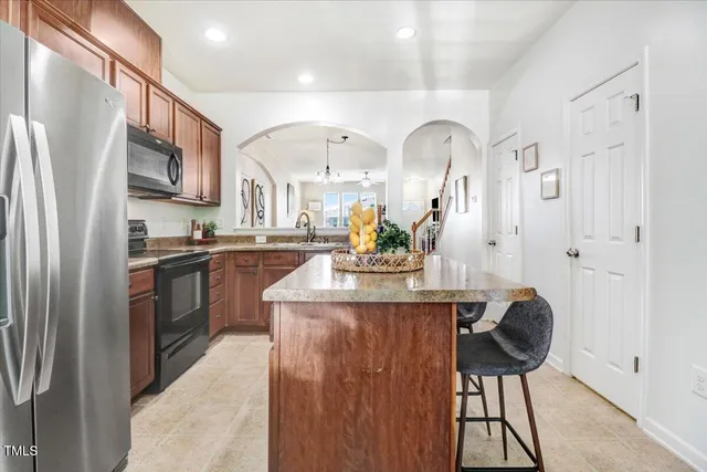 a view of kitchen island with furniture and wooden floor