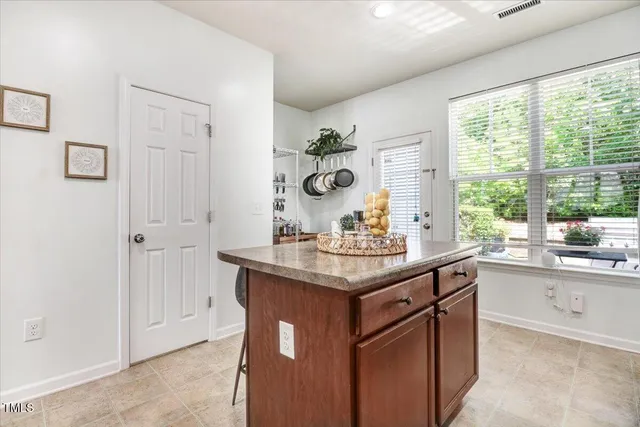 a kitchen with stainless steel appliances granite countertop a sink and cabinets
